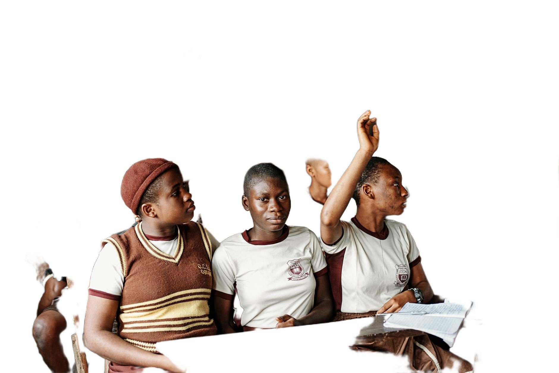 students with hands raised